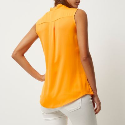 Orange wrap front sleeveless blouse